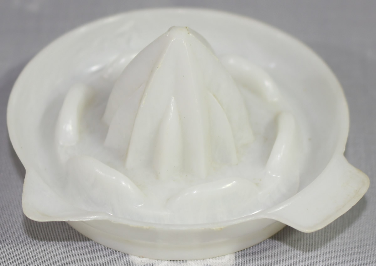 Small white toy plastic juicer 