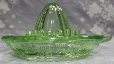 The end view of a Crown Crystal Glass Type 4 green glass juicer