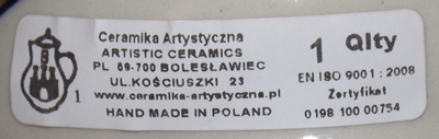 Paper label on a blue polka dots on white Poland ceramic juicer