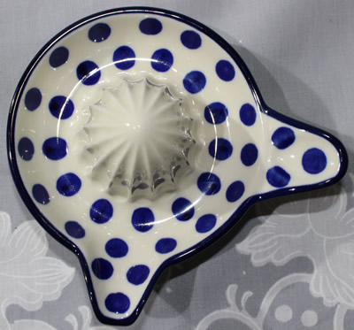 Top view of an Artistic Ceramics ( Poland) dark blue polka dots on white ceramic juicer