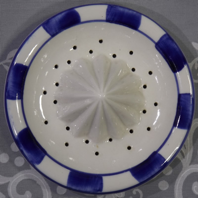 Corn on blue and white ceramic reamer