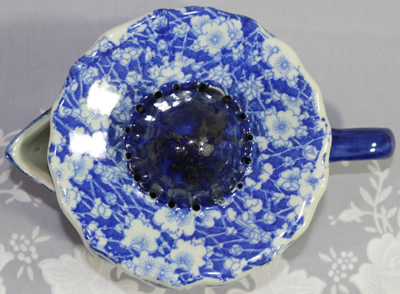 Top view of a blue & white chintz calico ironstone juicer
