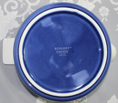 The base of a white with indigo base Ecology ceramic juicer