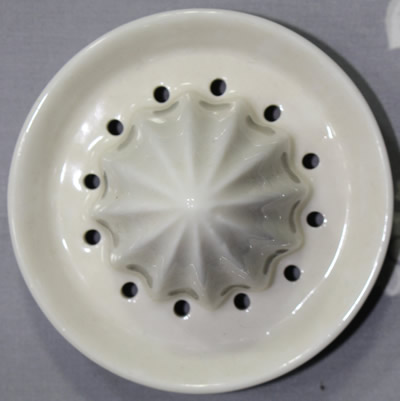 The reamer for a small 2 piece blue on white pagodas juicer