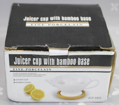 The box for a white 'Juicer cup with bamboo base'