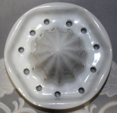 Hexagonal pattern reamer on a white ceramic 2 piece juicer