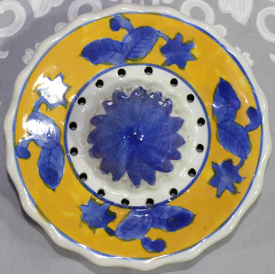 Reamer for a yellow with blue flowers ceramic juicer