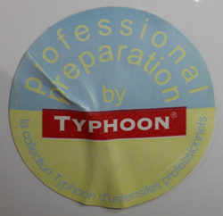 Label on a white double spout strainer ceramic juicer 