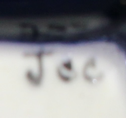 Jcc potter's mark on NRCA 2005 dark blue boy ceramic juicer