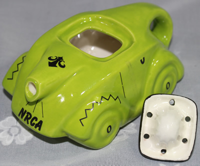 Two parts of green NRCA 2009 car ceramic juicer