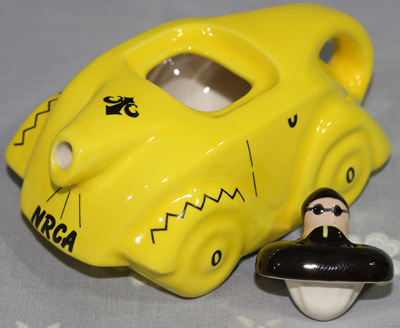 Two parts of Yellow NRCA 2009 car ceramic juicer