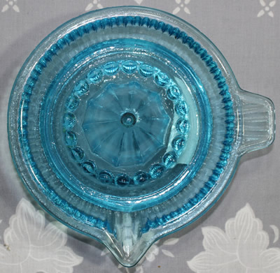 Top view of a Wheel&Barrow Chinese blue glass ribbed juicer
