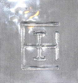 The embossed maker's mark on the base of a 2 piece clear glass juicer