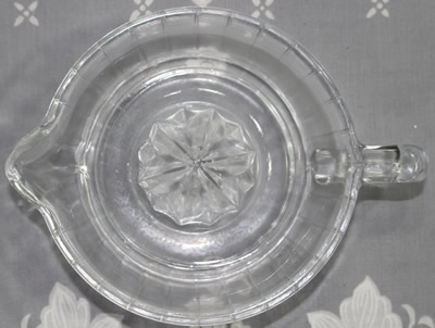 Top view of a Cuisena clear glass loop handle juicer