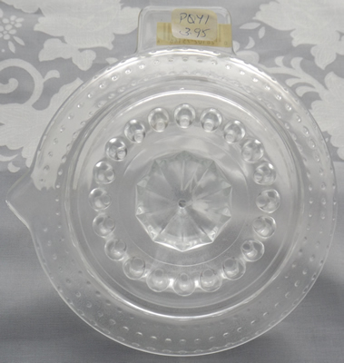 Bottom of a hobnail glass juicer showing price