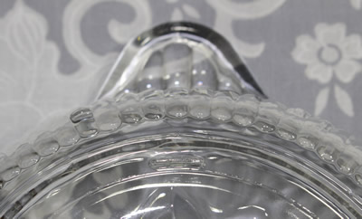 Showing the plain base and feet on an Anchor Hocking ribbed glass juicer