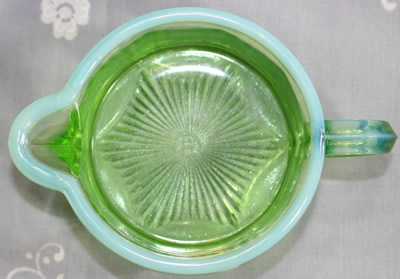 Base of the jug for an Edna Barnes frosted green glass juicer 