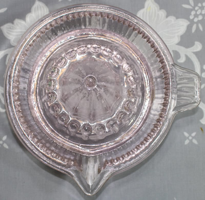 Top view of a Chinese pink glass juicer 