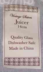 A label on a 'Vintage Sisters' Chinese pink glass juicer 