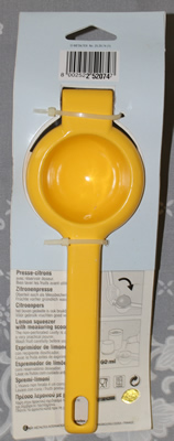 Back of packaged Metaltex hinged yellow aluminium hand held squeezer