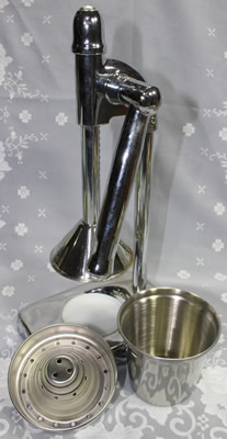 The 3 parts of a heavy stainless steel lever squeezer