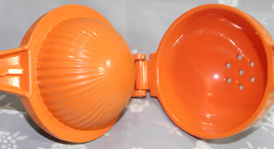 An open orange powder coated aluminium squeezer