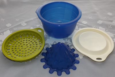 4 parts of Blue, lime green and cream Tupperware juicer
