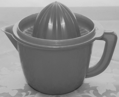 An open blue plastic juicer on jug with lid
