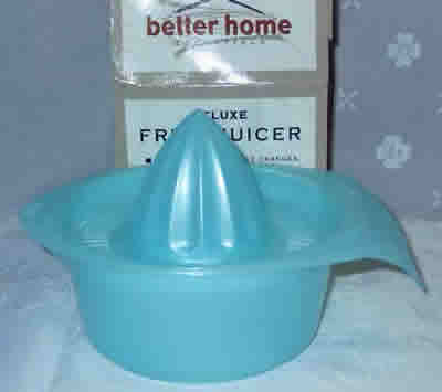 The Better Homes Essentials version of a translucent pale blue plastic juicer