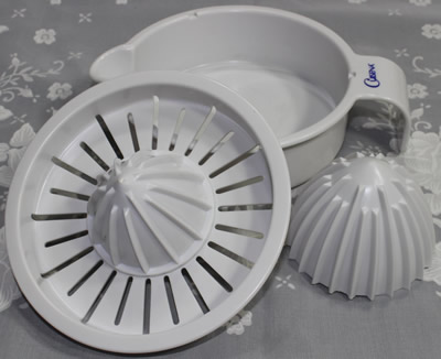 The 3 parts of a Cuisena 3 piece off white plastic juicer