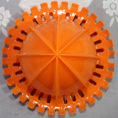 Reamer for an orange, white and clear plastic 3 piece jug juicer