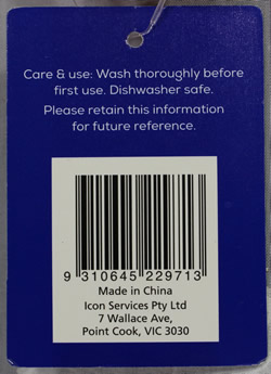 The reverse label on a red Kitchen Additions plastic juicer 