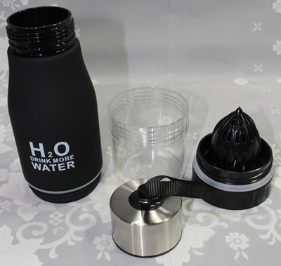 The 4 parts of a black H2O Drink More Water plastic bottle with juicer