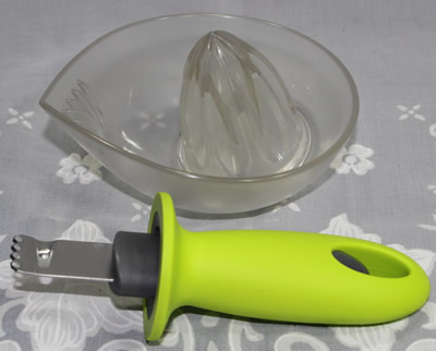 The 2 parts of a Kilo 2 piece plastic juicer with zester