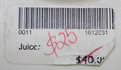 Barcode label on white Australian pottery saucer juicer