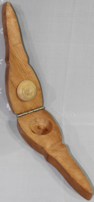An open "WOODEN LEMON SQEEZER" hand held squeezer 
