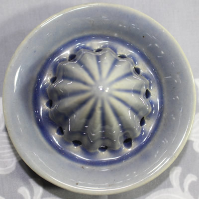 The reamer for an embossed P.S.K. blue ceramic juicer