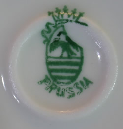 The basemark for a fruit on white with gold trim Prussian 2 piece juicer