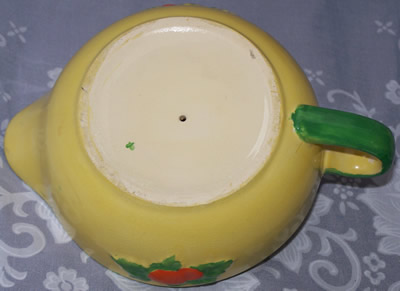 BaseRed fruit on yellow juicer