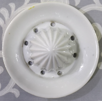 Yellow and white ceramic "A Present from Brighton" reamer
