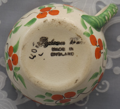 Base of a Sylvan Ware 2 piece juicer with small oranges pattern 