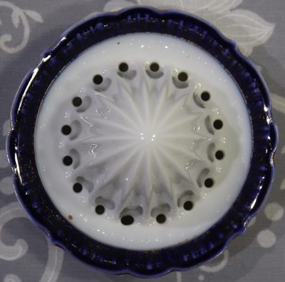 Roses on German juicer with blue and gold highlights reamer