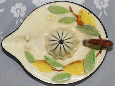 Top view of a lemons on cream loop handle juicer 