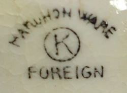 The basemark on a lemons on cream loop handle juicer