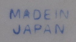 The blue basemark on an orange, yellow and green pear shape juicer 