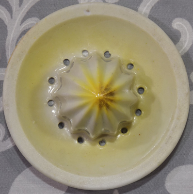 Reamer of 3 part Cream with yellow highlights and green pear shape