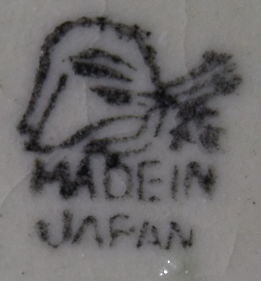 Basemark on a brown and black on green cottagewith showing the water wheel juicer