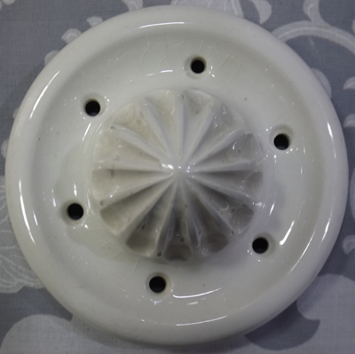 White with red and yellow flowers English pot handle reamer