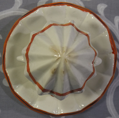 Goebel orange and white clown reamer with black highlights