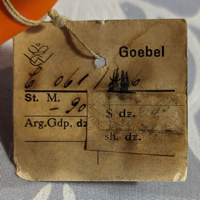 Goebel museum tag for an orange and white clown juicer with black highlights